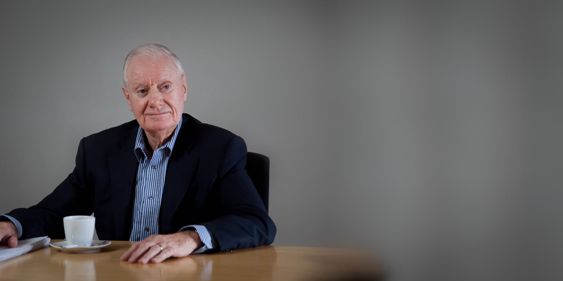 Tom Hogg seated at a table in 2012